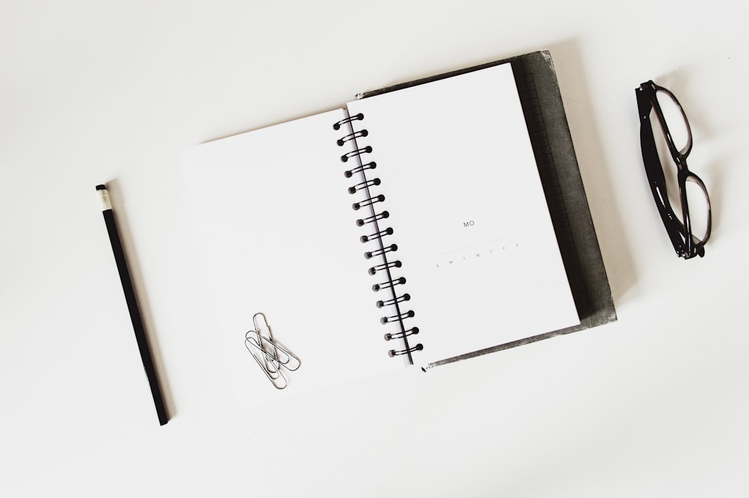 about-02 flat-lay-photography-of-textbook-and-eyeglasses-6gpbvylapyq